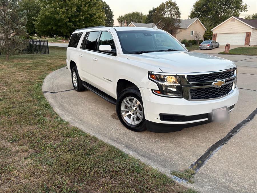 White Chevrolet Suburban after an exterior detail by Valor